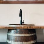 Barrel vanity sink detail in a custom barn build