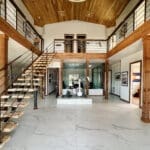 Open steel staircase in a modern barndominium interior