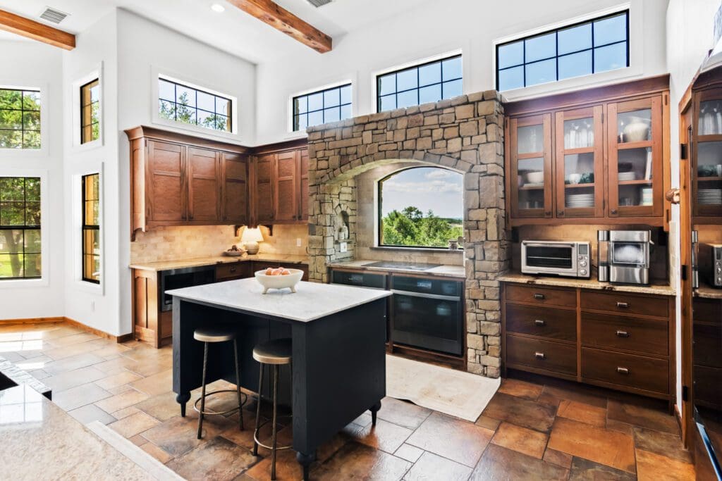 Custom home interior with large windows and natural light in Dripping Springs TX by Ridge Rock Builders