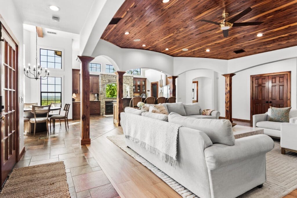 Custom home interior with wood ceiling and ceiling fan in Dripping Springs TX by Ridge Rock Builders