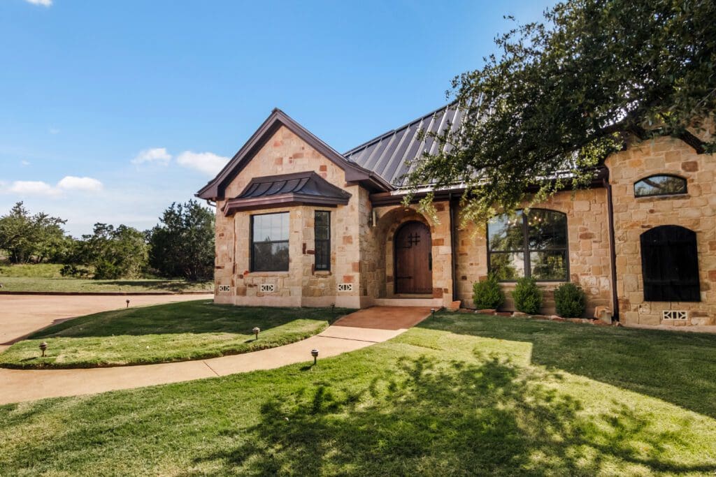Custom home exterior in Dripping Springs TX by Ridge Rock Builders