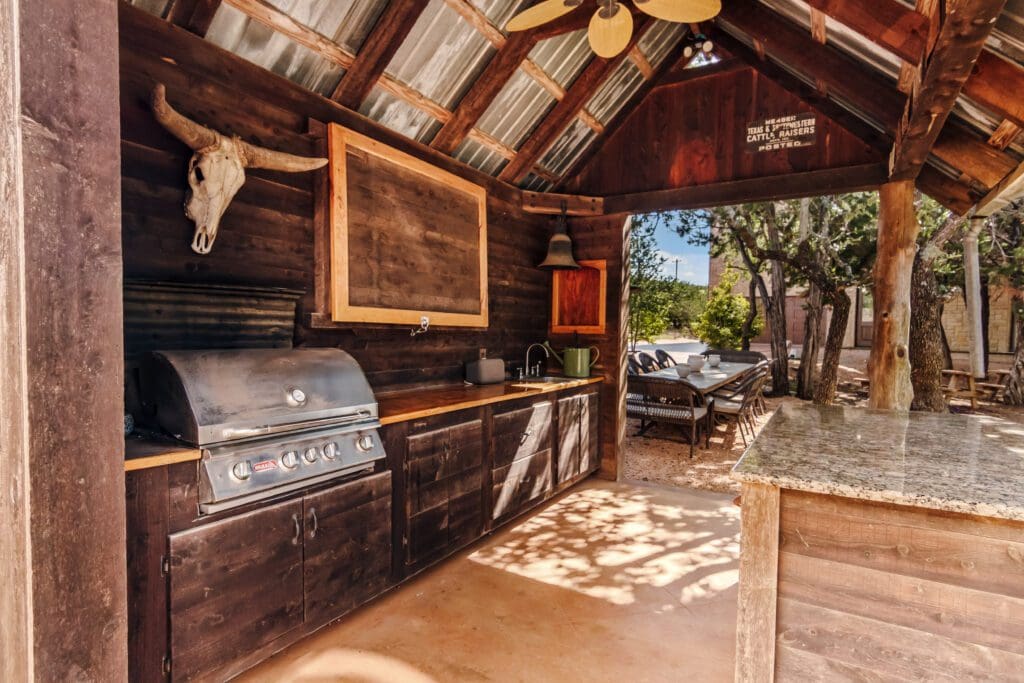 Custom home interior living area with wood beamed ceiling in Dripping Springs TX by Ridge Rock Builders