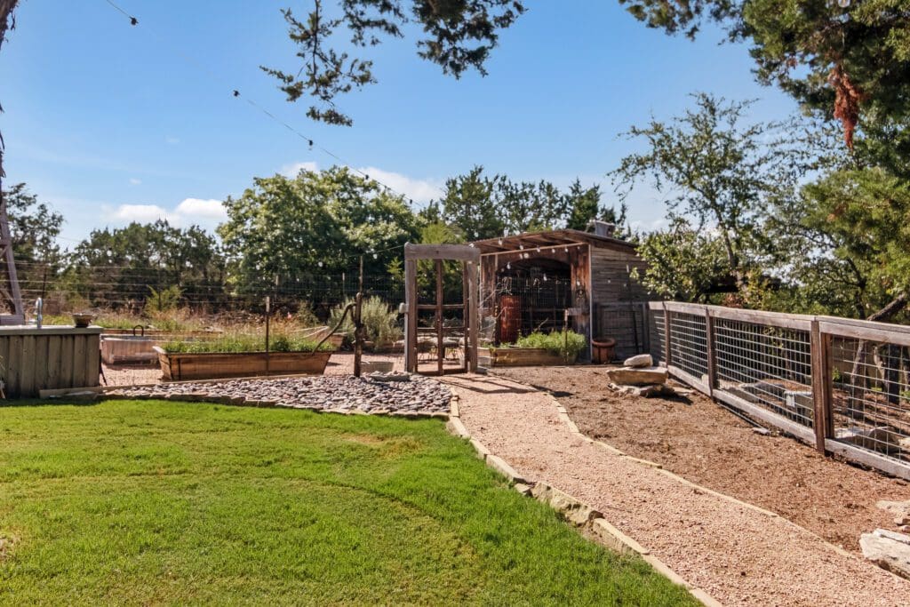Custom home backyard lawn and landscaping in Dripping Springs TX by Ridge Rock Builders