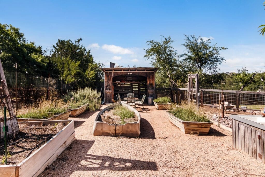 Custom home raised garden beds and landscaping in Dripping Springs TX by Ridge Rock Builders