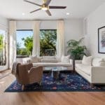 Bright casita living room with large windows and Hill Country views in a guest house by Ridge Rock Builders